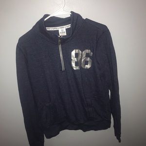 Pink semi-fitted quarter zip sweater.